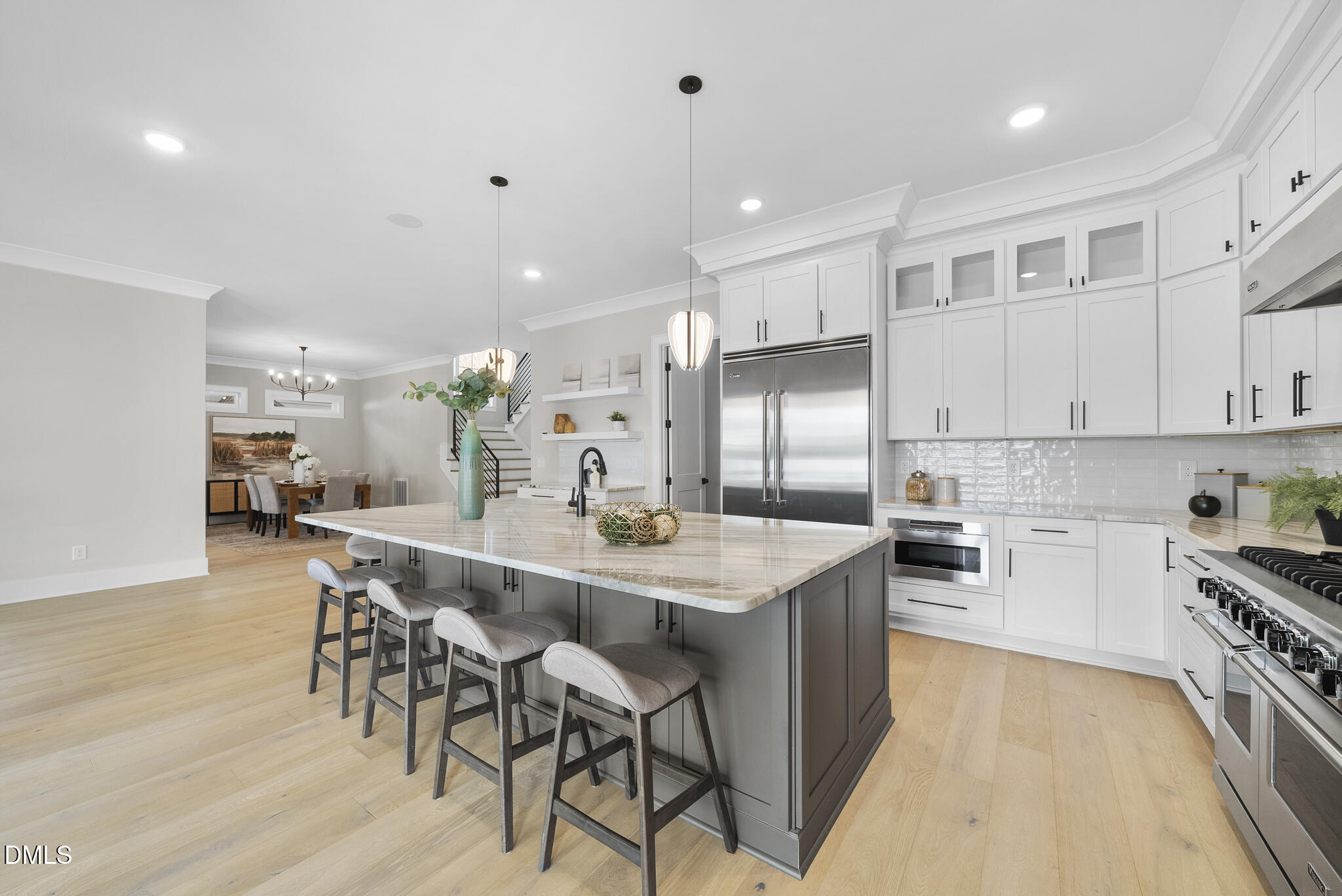 1003 Canterbury Road Raleigh, NC 27607 - Photo 7 of 45 a kitchen with stainless steel appliances kitchen island granite countertop a sink and cabinets