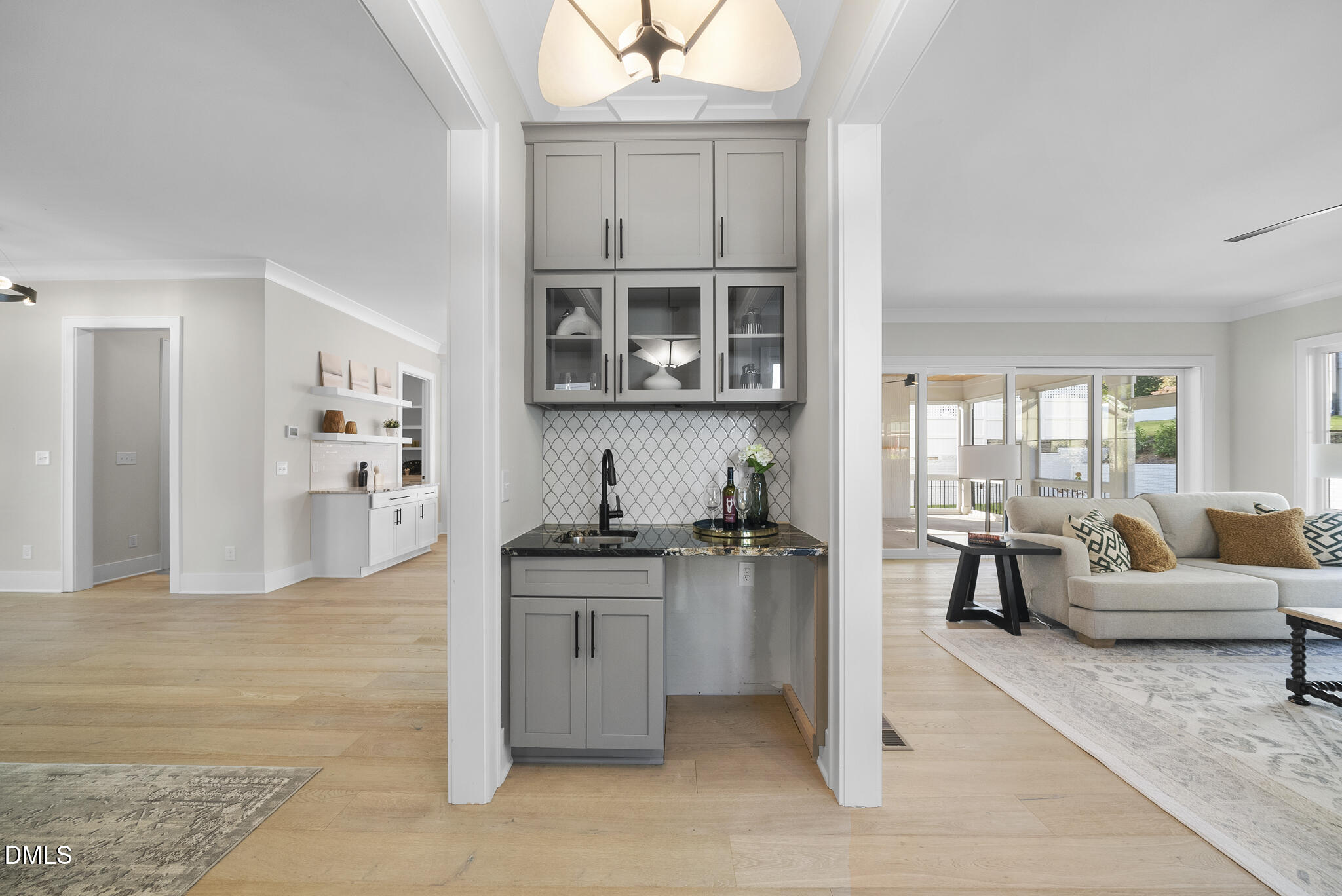 1003 Canterbury Road Raleigh, NC 27607 - Photo 8 of 45 a kitchen with stainless steel appliances granite countertop a stove top oven a sink a dining table and chairs with wooden floor