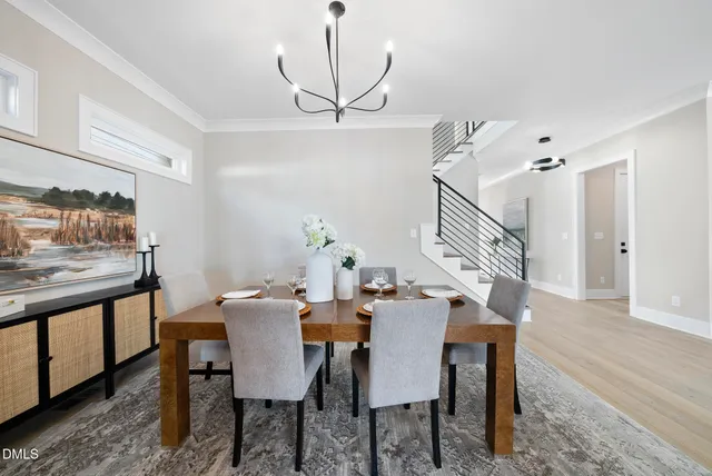 a living room with fireplace furniture and a large window