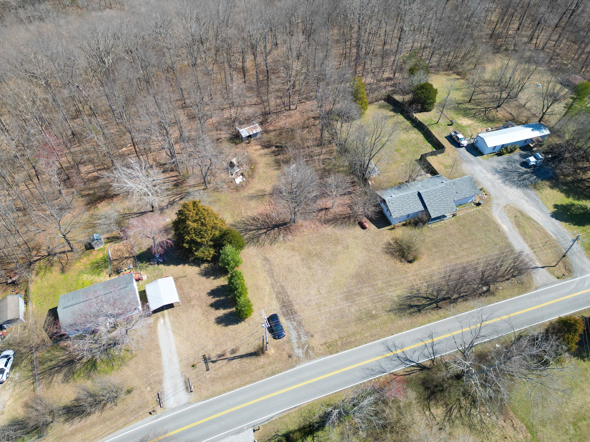 1 Bandy Road Ashland City, TN 37015 - Photo 76 of 84 an aerial view of a house with a yard and large trees
