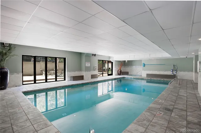 a large kitchen with lots of counter space and windows