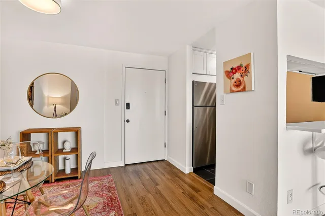 a view of a livingroom with furniture and wooden floor