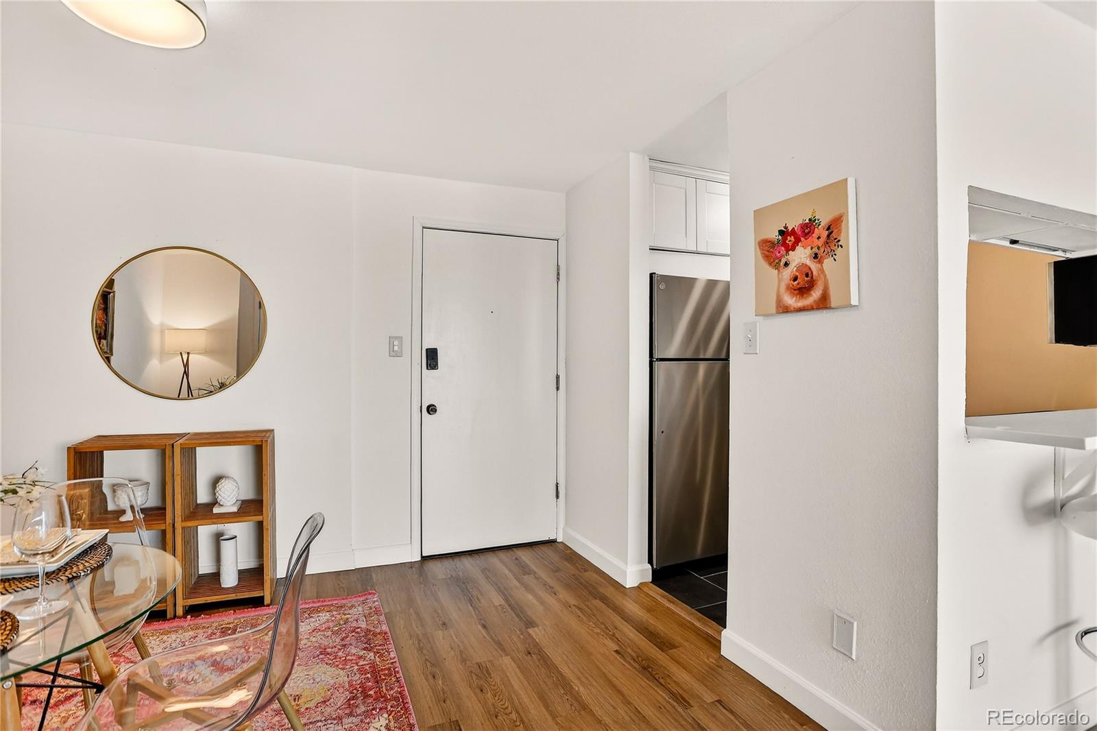 2 Adams Street, Unit 1401 Denver, CO 80206 - Photo 4 of 21 a view of a livingroom with furniture and wooden floor