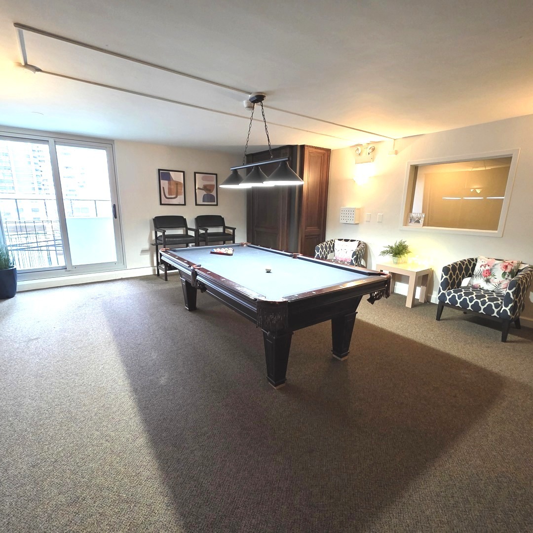 6033 North Sheridan Road, Unit 5G Chicago, IL 60660 - Photo 18 of 24 a room with pool table and windows
