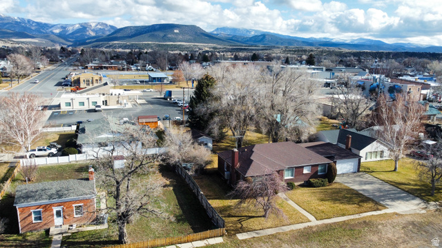 160 North 100 W Street Beaver, UT 84713 - Photo 35 of 36 Aerial view of residential area with a mountainous background