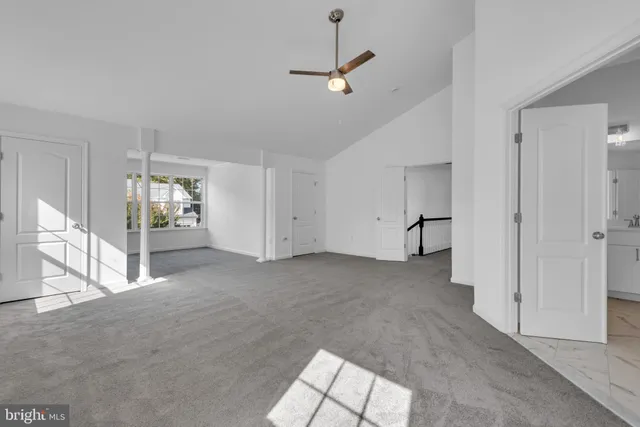 a view of an empty room with a fireplace