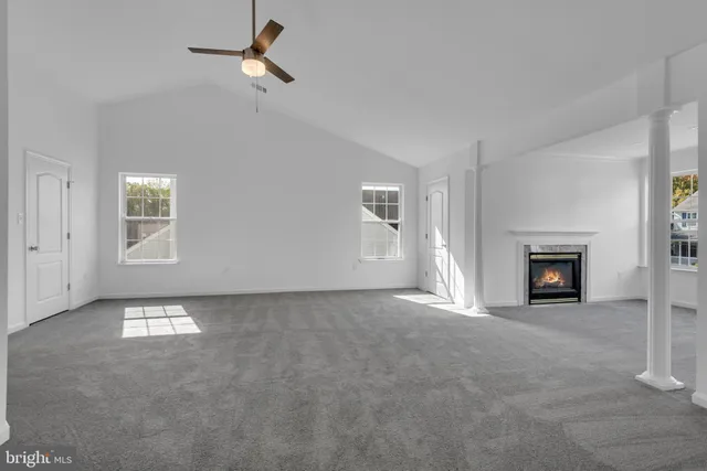 a view of walk in closet with clothes