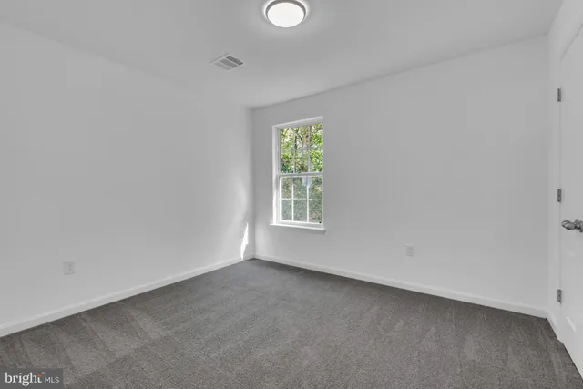 a view of a kitchen with a refrigerator