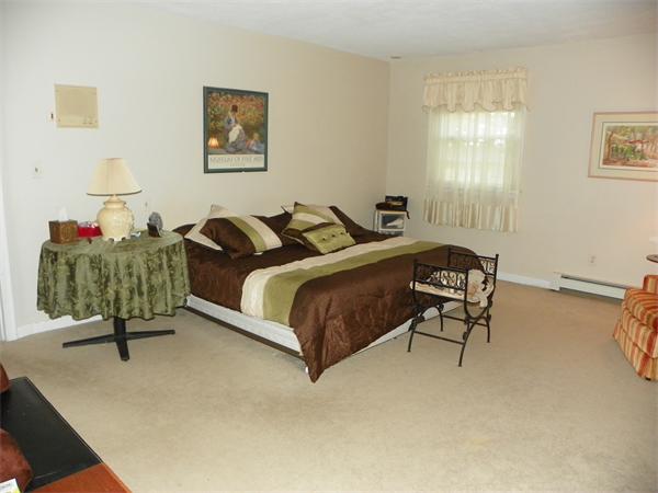 50 Algonquin Road Canton, MA 02021 - Photo 12 of 26 a bedroom with a bed and a dresser in it