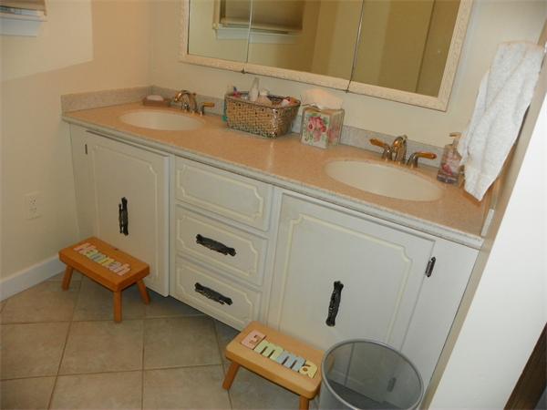 50 Algonquin Road Canton, MA 02021 - Photo 13 of 26 a bathroom with a sink and a mirror