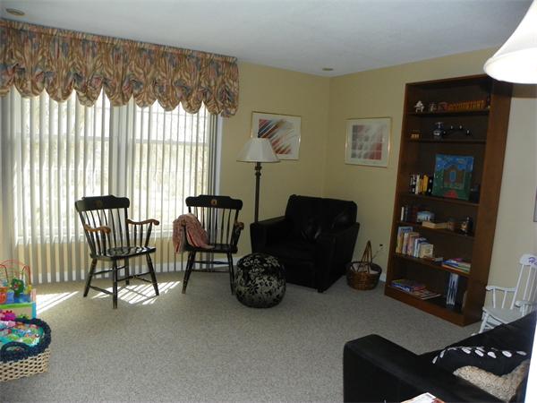 50 Algonquin Road Canton, MA 02021 - Photo 15 of 26 a living room with furniture and a floor to ceiling window