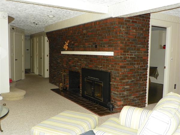 50 Algonquin Road Canton, MA 02021 - Photo 17 of 26 a bedroom with a bed and a fireplace
