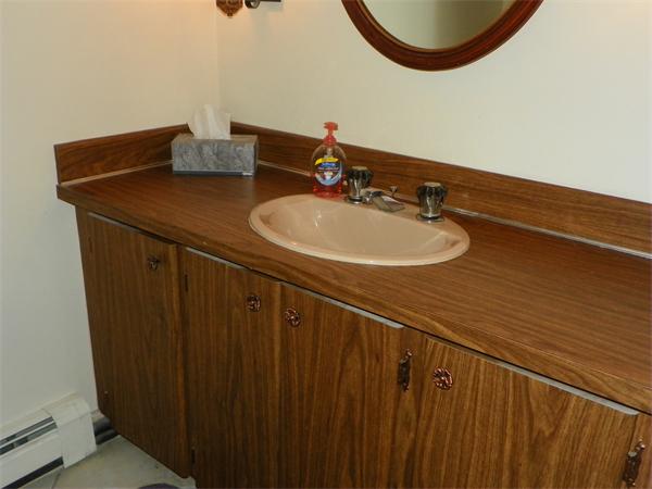 50 Algonquin Road Canton, MA 02021 - Photo 21 of 26 a bathroom with a sink and a mirror