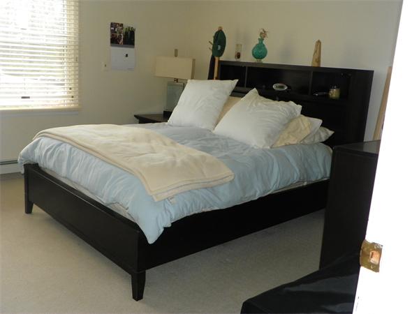 50 Algonquin Road Canton, MA 02021 - Photo 23 of 26 a bedroom with a bed and window
