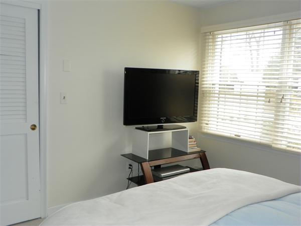 50 Algonquin Road Canton, MA 02021 - Photo 24 of 26 a room with a bed and a flat screen tv