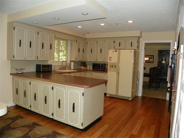 50 Algonquin Road Canton, MA 02021 - Photo 6 of 26 a kitchen with stainless steel appliances a refrigerator sink and cabinets