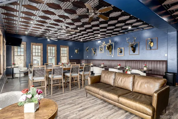 a open kitchen with stainless steel appliances granite countertop a stove and a sink