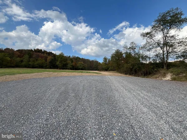 a view of a field with sitting space