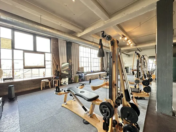 a room with gym equipment and a large window