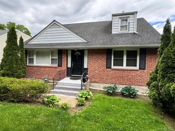 front view of a house and a yard