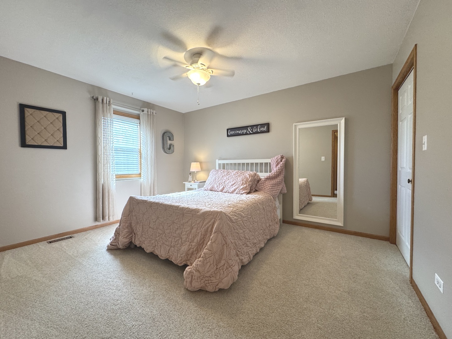 2041 Bluff Road South Kankakee, IL 60901 - Photo 20 of 39 a spacious bedroom with a bed and a chandelier