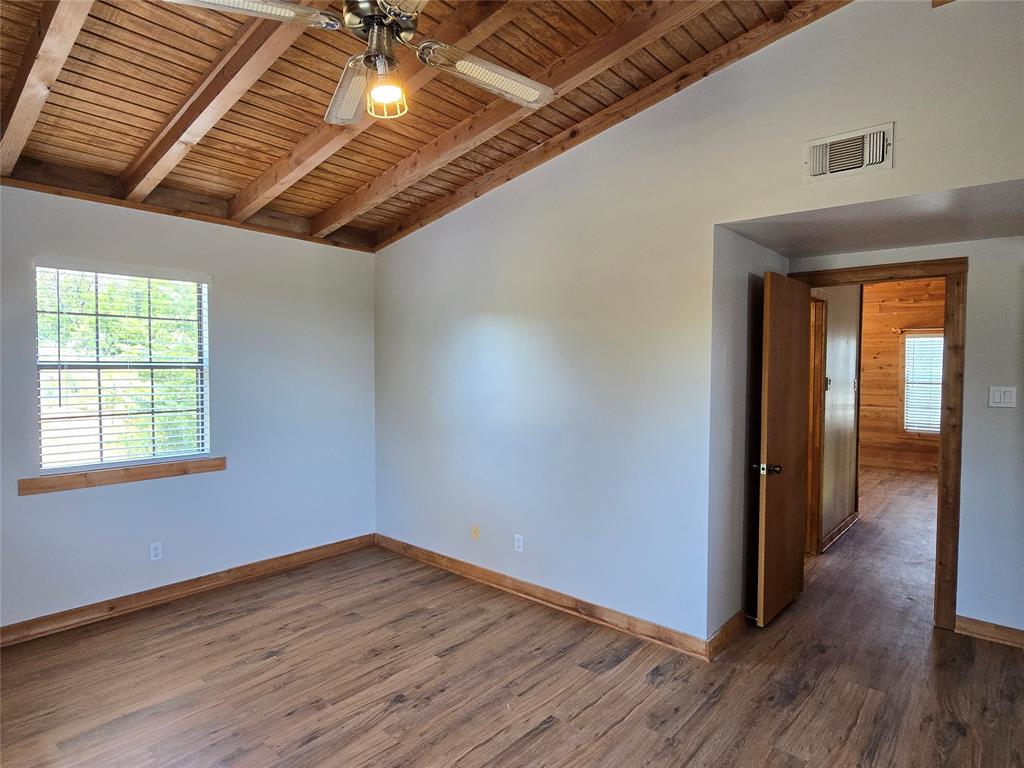 3505 Farmer Road Azle, TX 76020 - Photo 25 of 40 Only bedroom upstairs has a vaulted ceiling. New wood-look luxury vinyl plank flooring and window blinds--installed summer 2026!