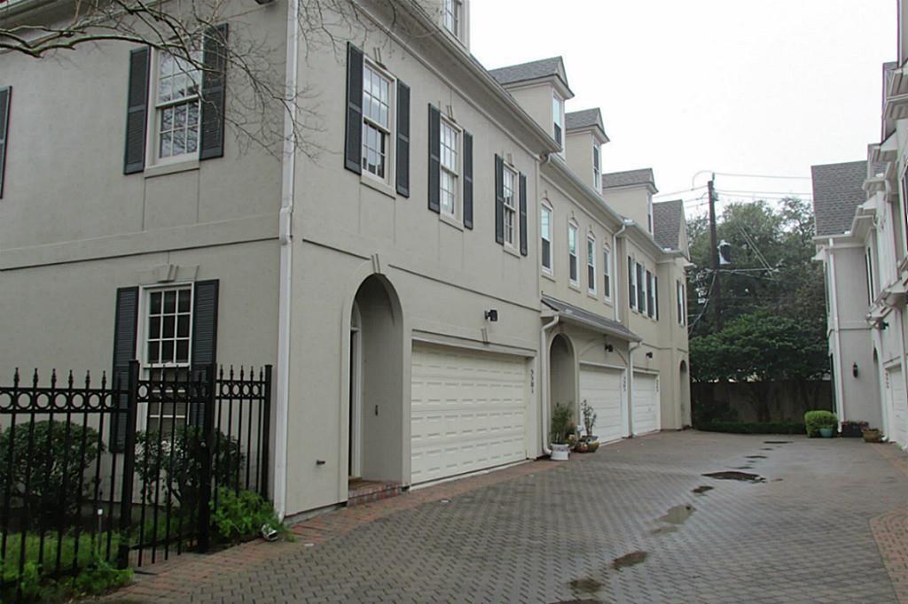 a front view of a house with parking space and parking space