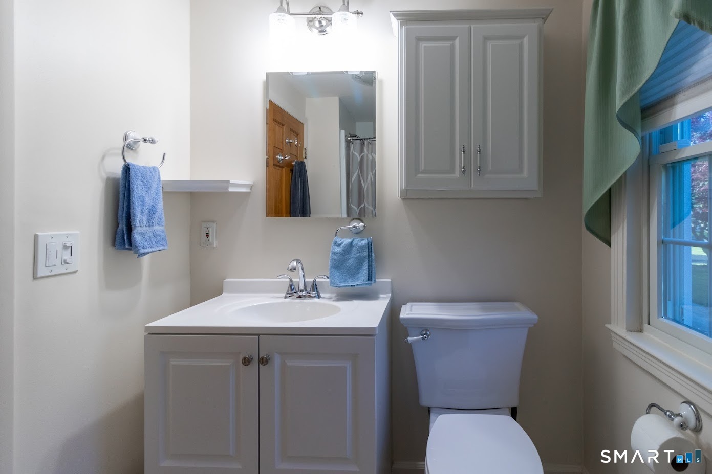 763 North Street Suffield, CT 06078 - Photo 33 of 40 a bathroom with a toilet sink and mirror