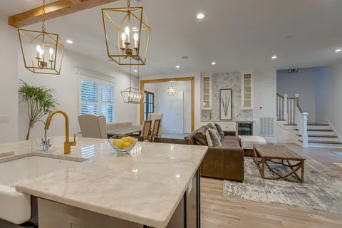 a large kitchen with a table and chairs