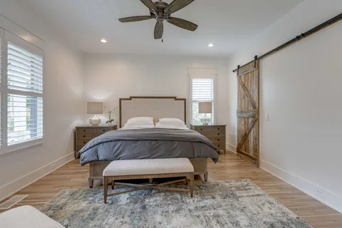 a bedroom with a bed and window