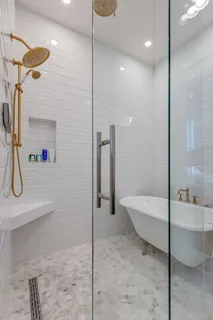 a bathroom with a tub and a shower
