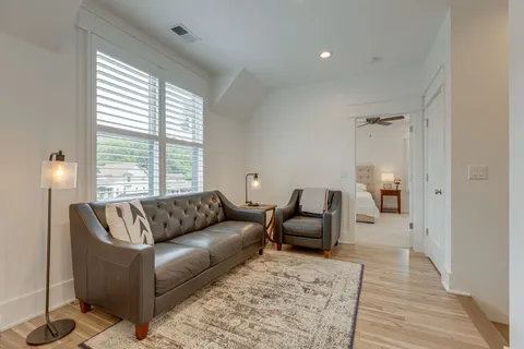 a living room with furniture and a window
