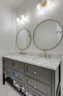 a bathroom with a shower and a bath tub