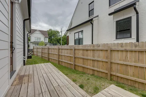an aerial view of a house with a yard and potted plants