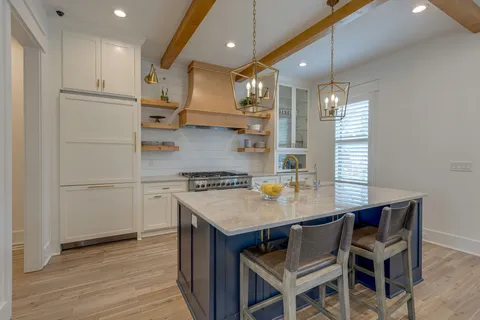 a kitchen with a table and chairs in it