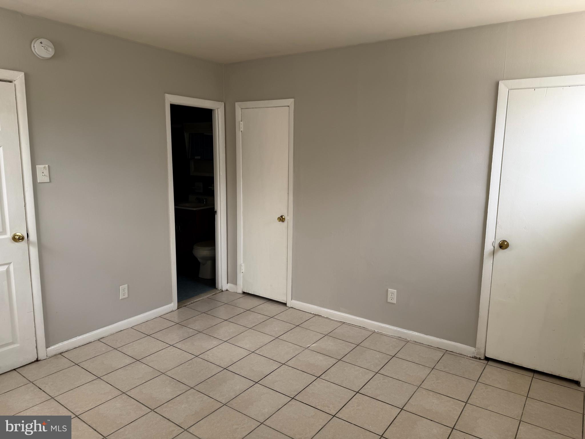 5711 Erdrick Street, Unit 3 Philadelphia, PA 19135 - Photo 11 of 18 a view of an empty room and window
