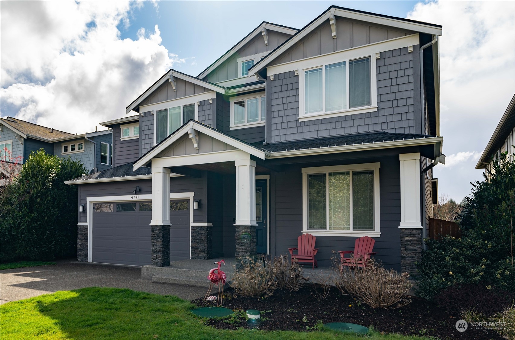 4731 Rosa Court Lacey, WA 98503 - Photo 1 of 31 a front view of a house with a yard and garage