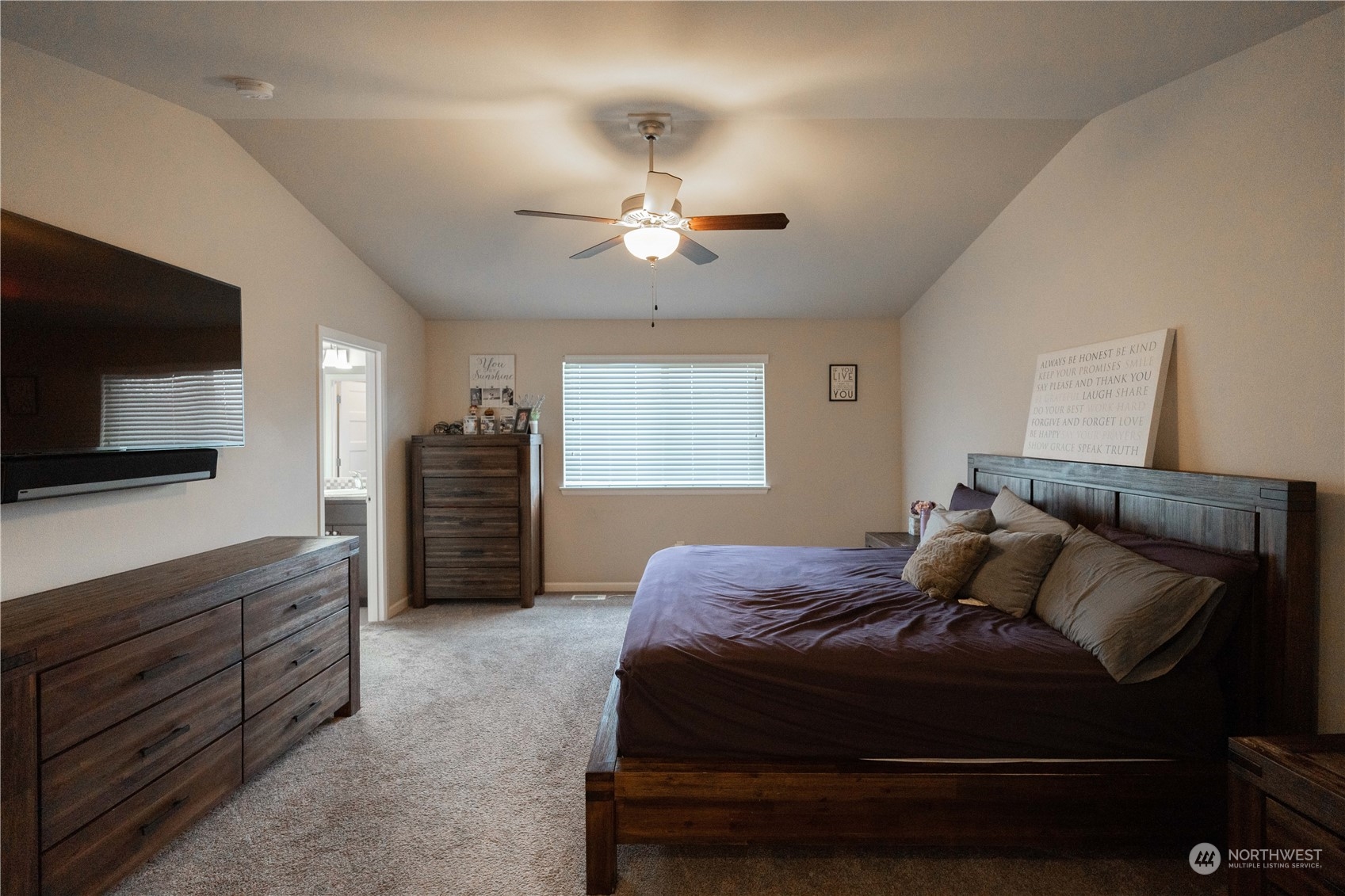 4731 Rosa Court Lacey, WA 98503 - Photo 19 of 31 a bedroom with a bed and a flat screen tv