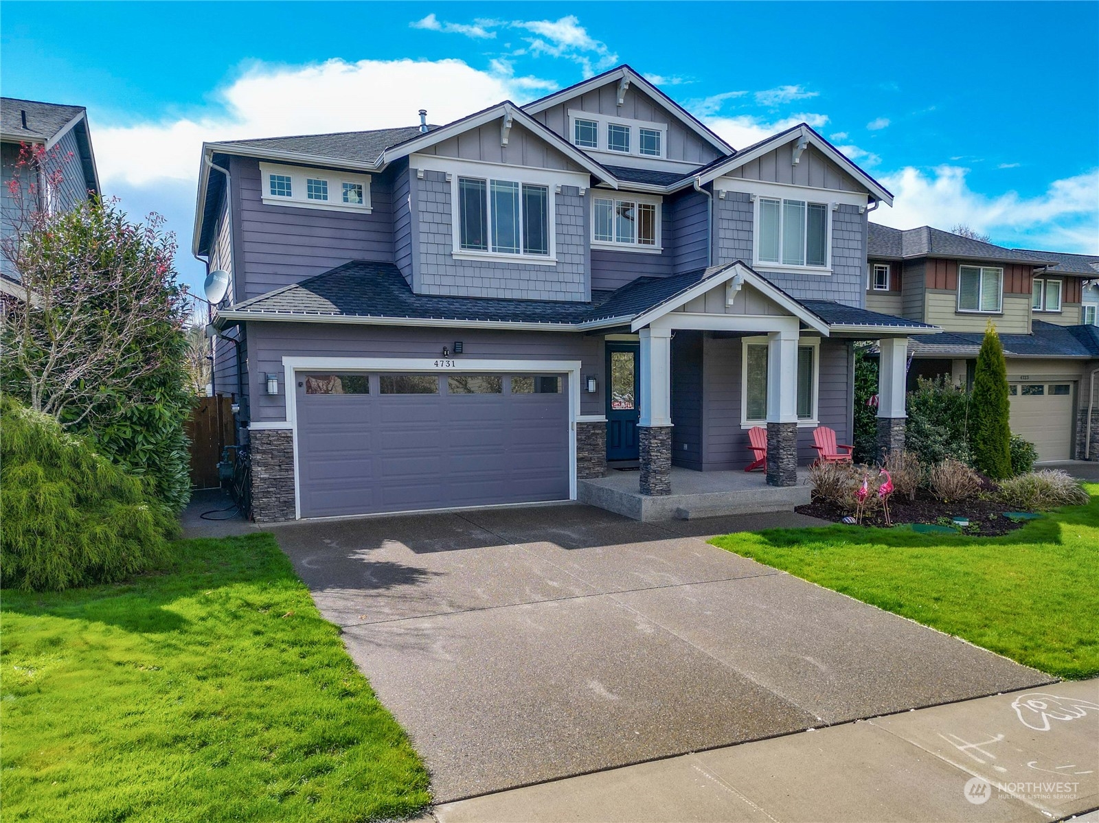 4731 Rosa Court Lacey, WA 98503 - Photo 2 of 31 a front view of a house with a yard and garage