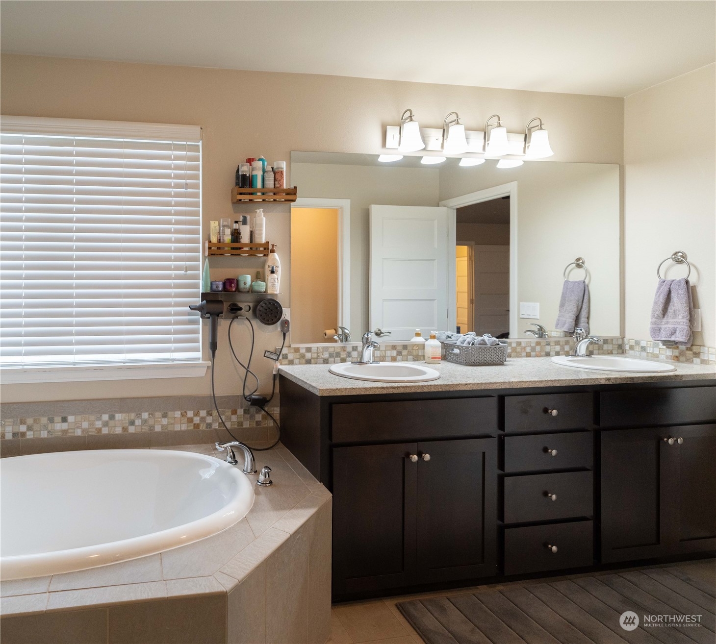 4731 Rosa Court Lacey, WA 98503 - Photo 21 of 31 a bathroom with a sink double vanity and a mirror