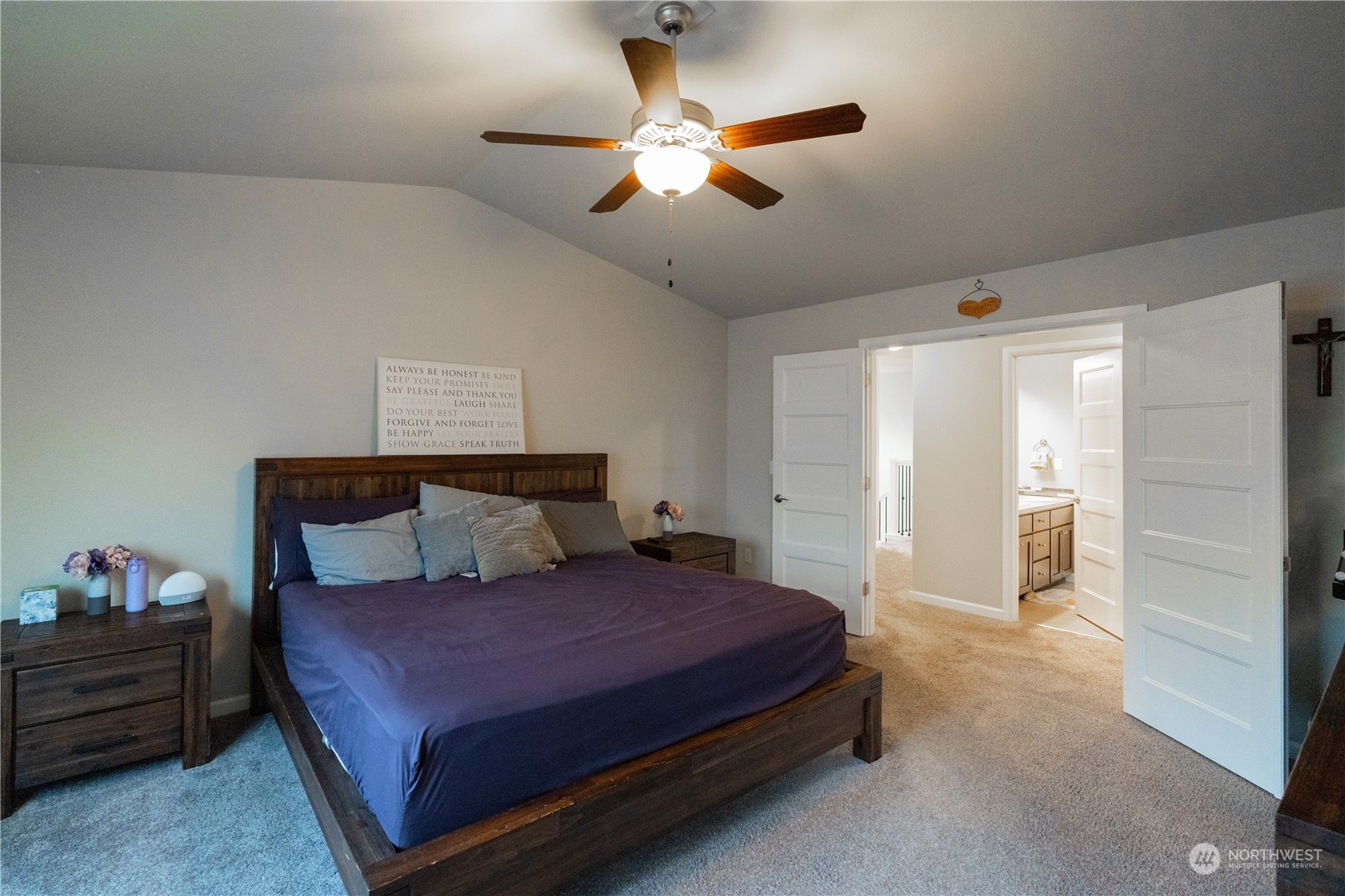 4731 Rosa Court Lacey, WA 98503 - Photo 23 of 31 a spacious bedroom with a bed and a ceiling fan