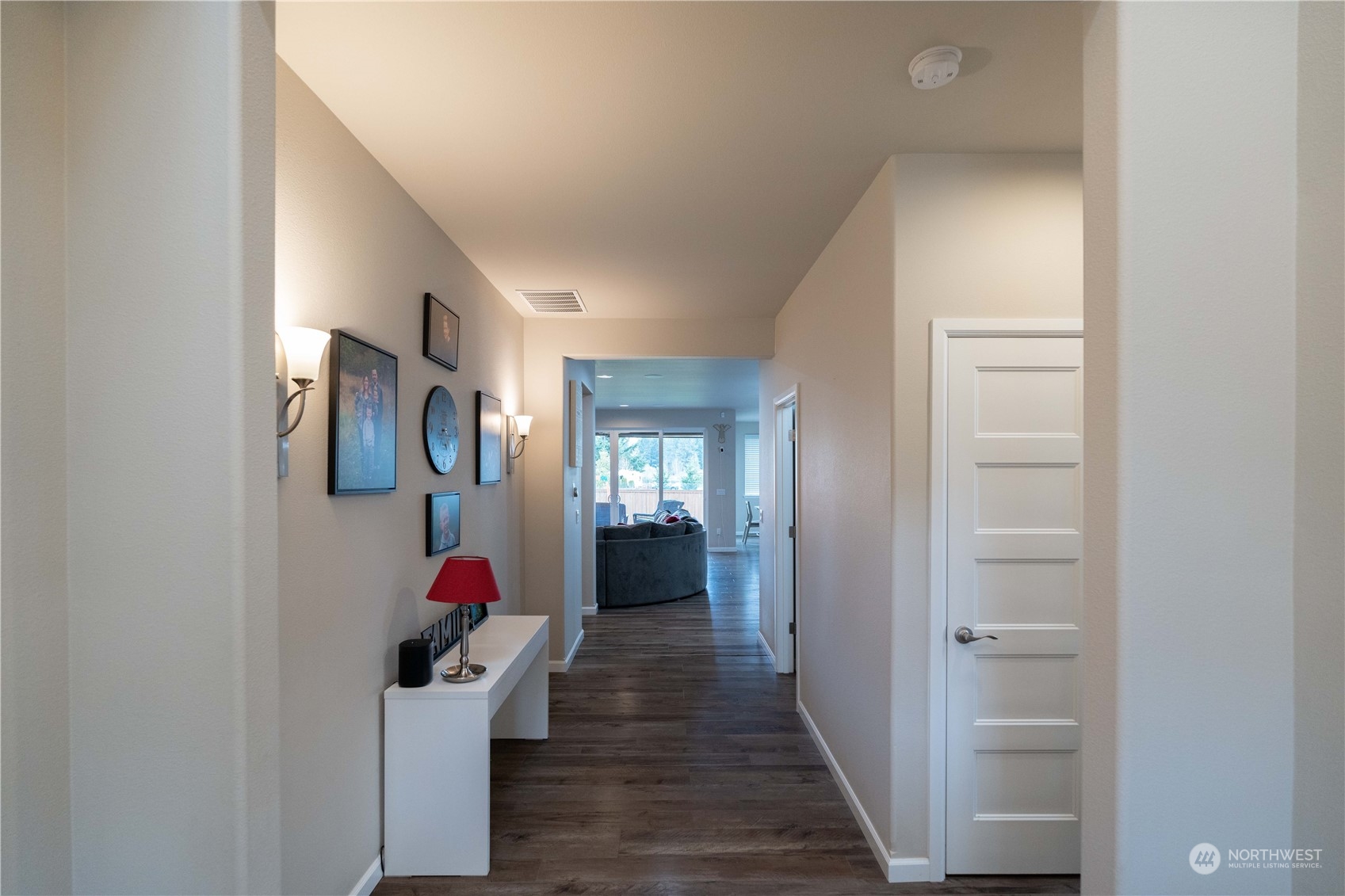 4731 Rosa Court Lacey, WA 98503 - Photo 3 of 31 a view of a hallway with wooden floor and furniture