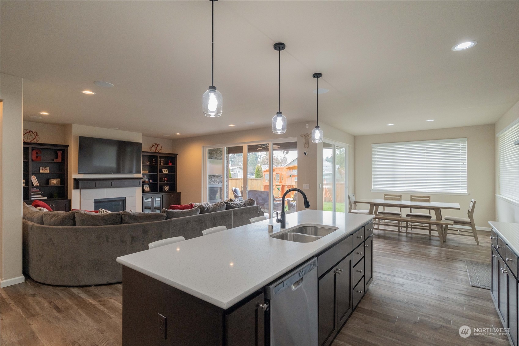 4731 Rosa Court Lacey, WA 98503 - Photo 4 of 31 a kitchen with counter top space appliances and a wooden floor