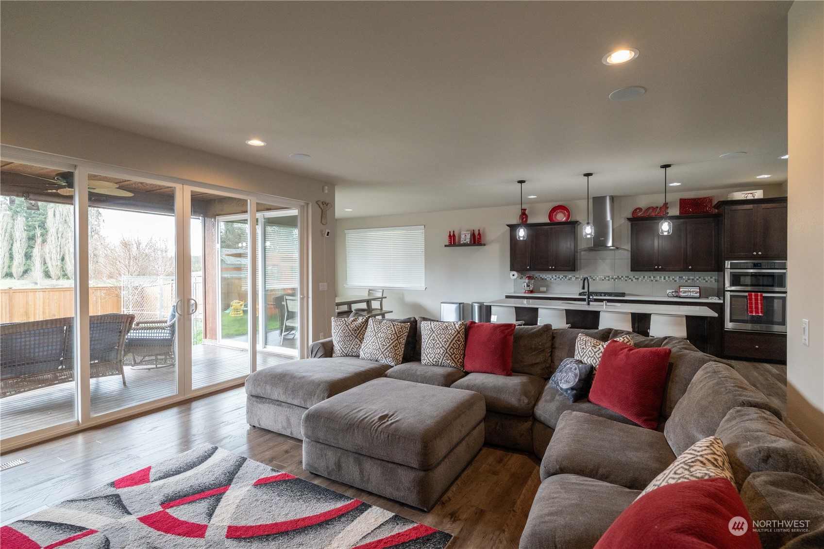 4731 Rosa Court Lacey, WA 98503 - Photo 8 of 31 a living room with furniture and a floor to ceiling window
