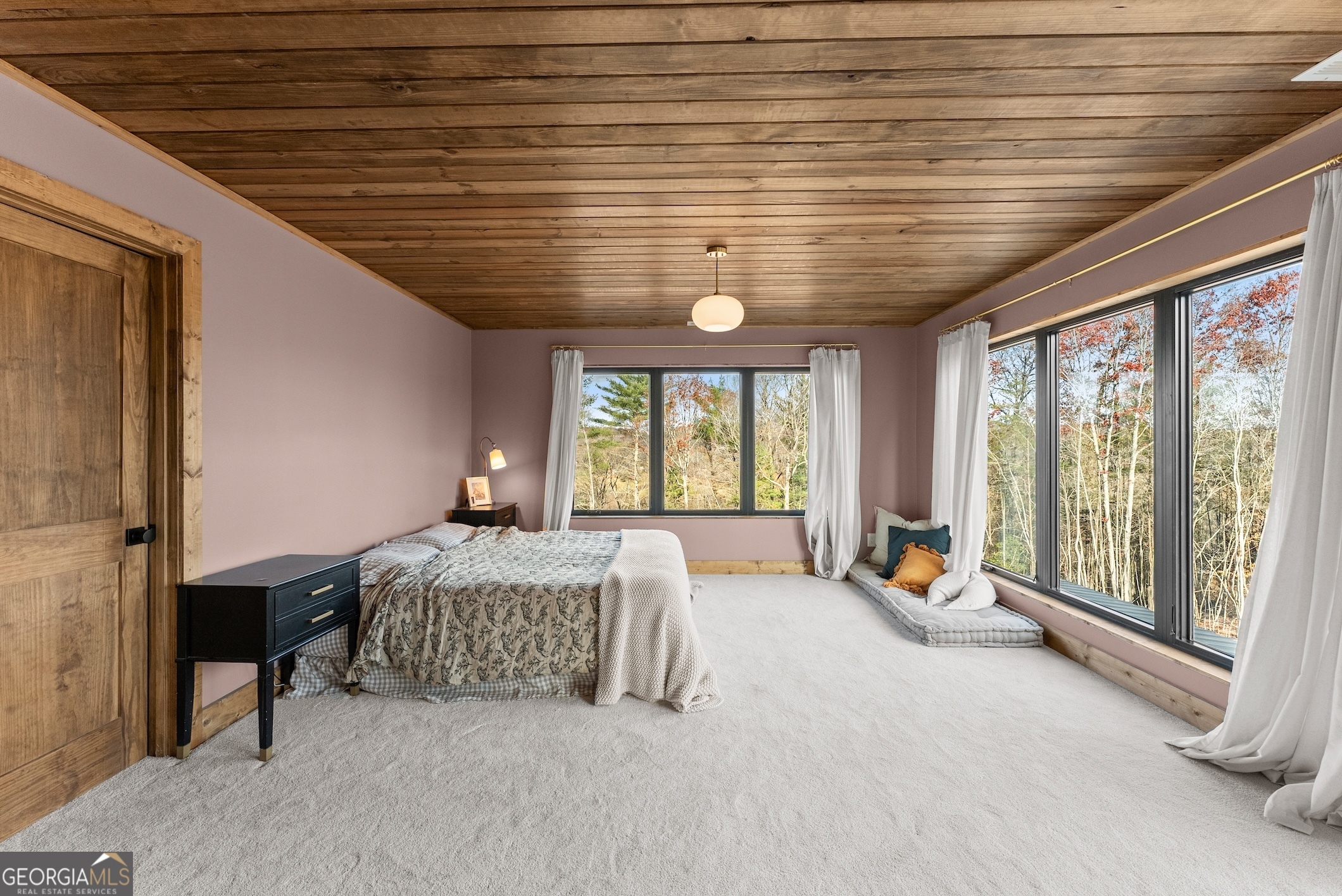 147 Jess Hunt Road West Cleveland, GA 30528 - Photo 28 of 69 a spacious bedroom with a large bed and a large window