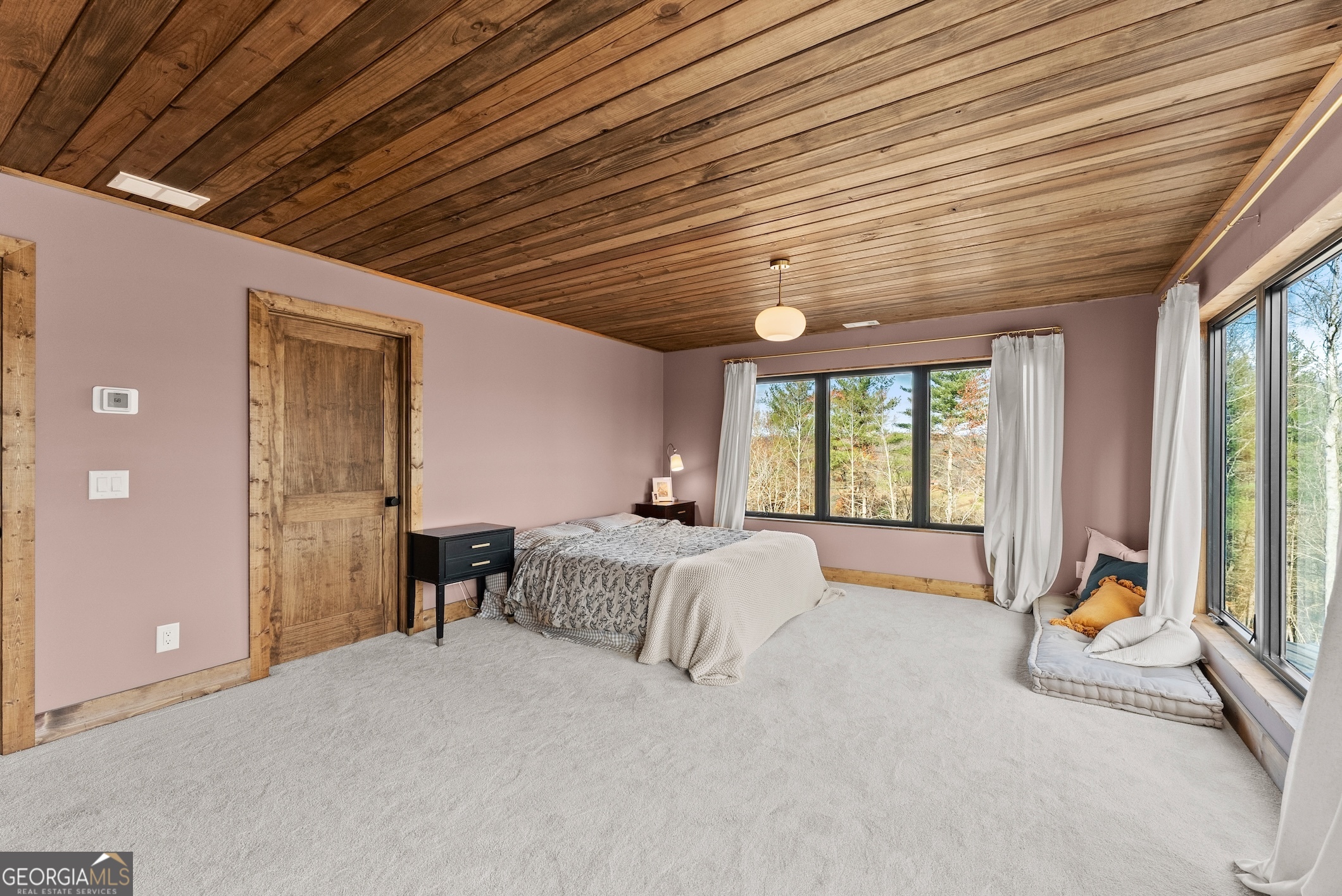 147 Jess Hunt Road West Cleveland, GA 30528 - Photo 32 of 69 a spacious bedroom with a bed and large windows