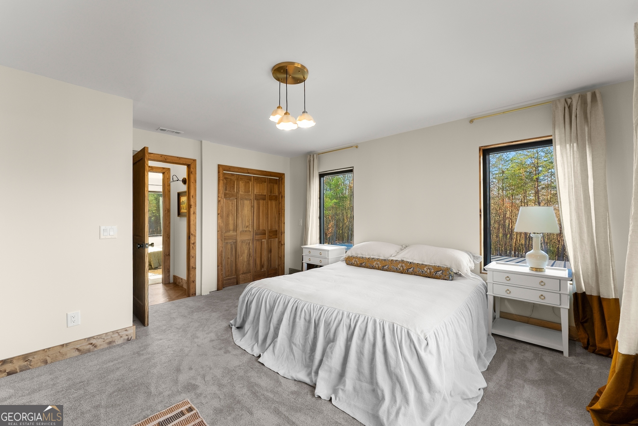 147 Jess Hunt Road West Cleveland, GA 30528 - Photo 39 of 69 a bedroom with a bed and a large window