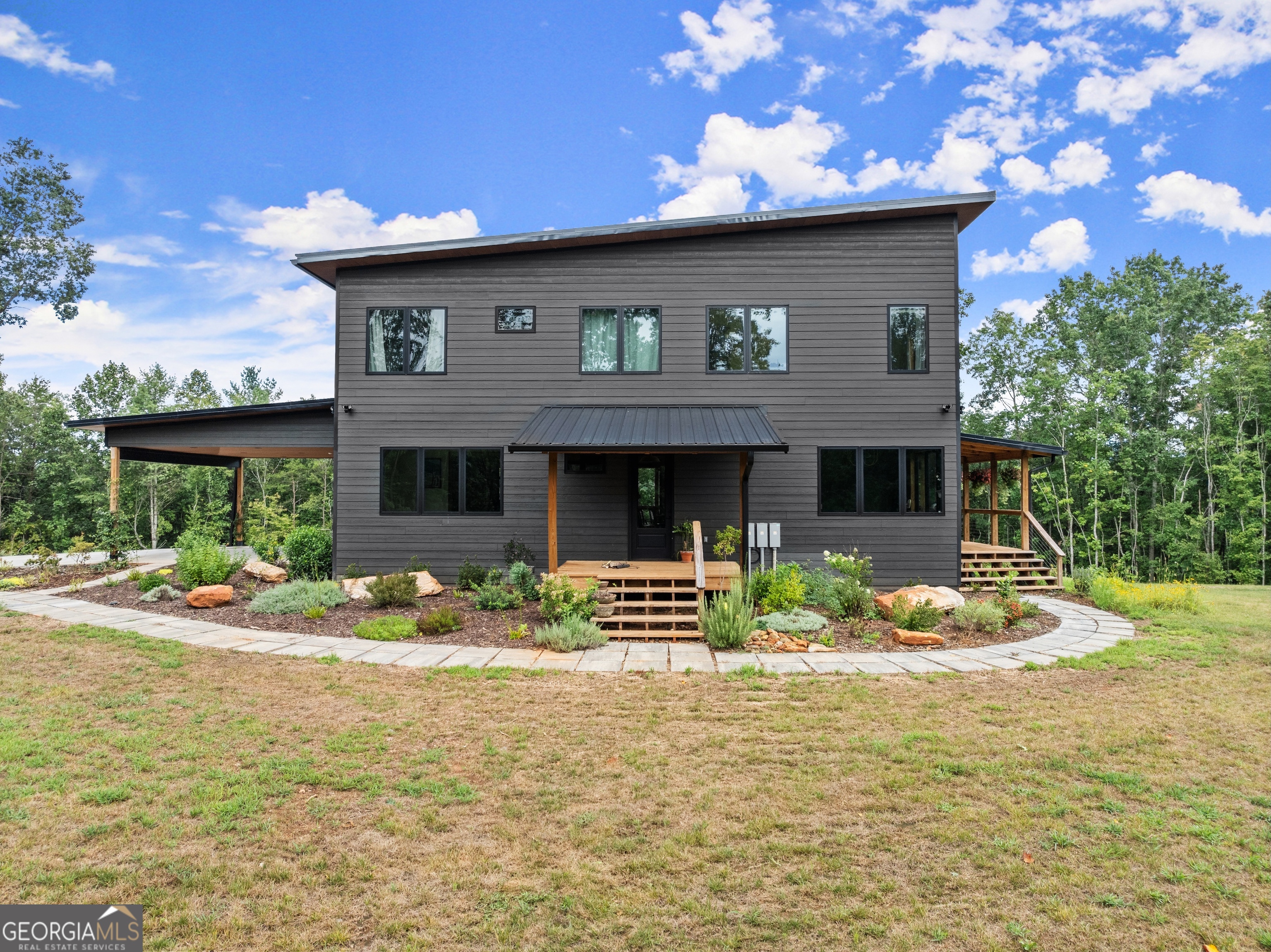 147 Jess Hunt Road West Cleveland, GA 30528 - Photo 4 of 69 a front view of a house with garden