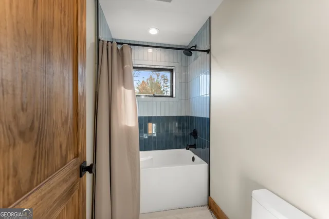 a view of a lush green forest with lots of trees