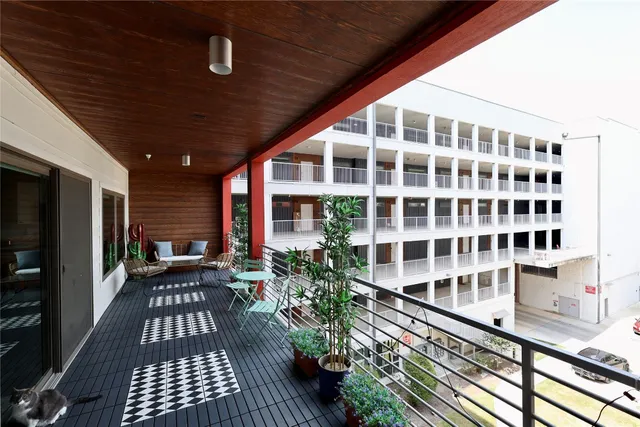 a view of balcony with wooden floor